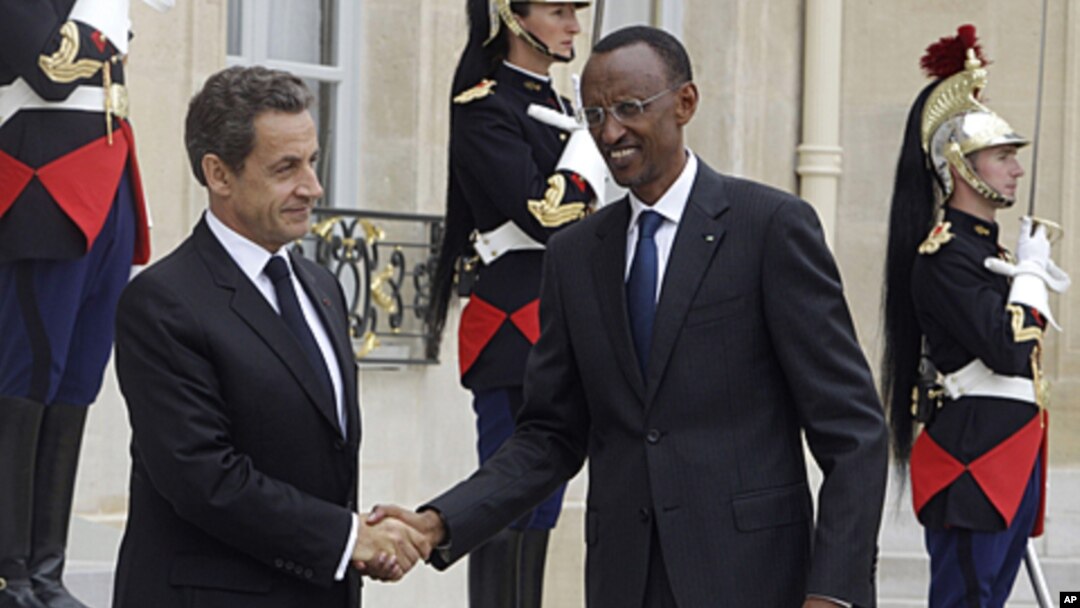 France's President Nicolas Sarkozy, left, welcomes Rwandan's President Paul Kagame, right, at the Elysee Palace. Kagame has warned outside powers against trying to "manage Africa" during a visit to France aimed at soothing tensions over the 1994 genocide 