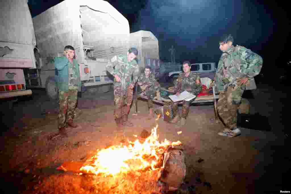 Peshmerga forces gather on the east of Mosul during preparations to attack Mosul, Iraq, Oct. 16, 2016.