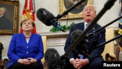 U.S. President Donald Trump meets with German Chancellor Angela Merkel in the Oval Office in Washington, April 27, 2018.