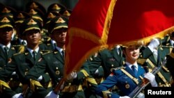 Honor guards march during a welcoming ceremony for Canadian Prime Minister Justin Trudeau at the Great Hall of the People in Beijing, China, Aug. 31, 2016. 