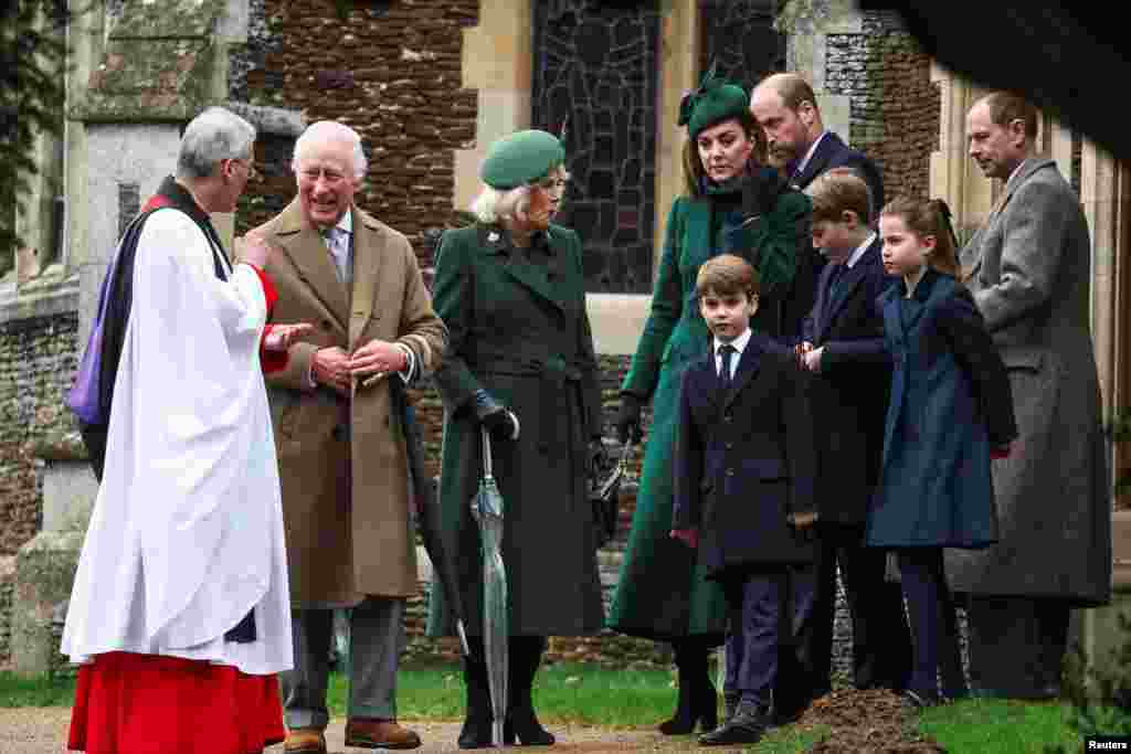 Britain&#39;s King Charles speaks with Reverend Canon Dr. Paul Williams, as Queen Camilla, Britain&#39;s William, Prince of Wales, Catherine, Princess of Wales, and other family members leave St. Mary Magdalene&#39;s church, on the Sandringham estate, Dec. 25, 2024.