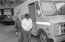 FILE - Rosie Ruiz, who was accused of cutting corners to win the Boston Marathon two years ago, leaves Central Booking at Police Headquarters in New York, April 20, 1982, where she was charged with stealing $60,000 from the firm where she worked.