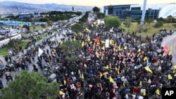 Hezbollah supporters protest near Beirut's international airport against Lebanon's decision to revoke permission for an Iranian carrier after Israel accused Iran of smuggling cash to Hezbollah, in Beirut, Feb. 15, 2025. 