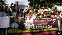 FILE - Journalists take part in a demonstration on the occasion of World Press Freedom Day in Lahore, Pakistan, May 3, 2024.