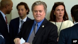 White House strategist Stephen Bannon waits for President Donald Trump to make a statement about the U.S. role in the Paris climate change accord, June 1, 2017, in the Rose Garden of the White House.