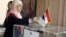 An Egyptian expatriate living in Lebanon casts her vote in a referendum on the new Egyptian constitution at the Egyptian embassy in Beirut December 12, 2012.
