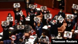 The main opposition Kuomintang (KMT) party stages a protest to oppose the import of U.S. pork containing ractopamine in Taipei