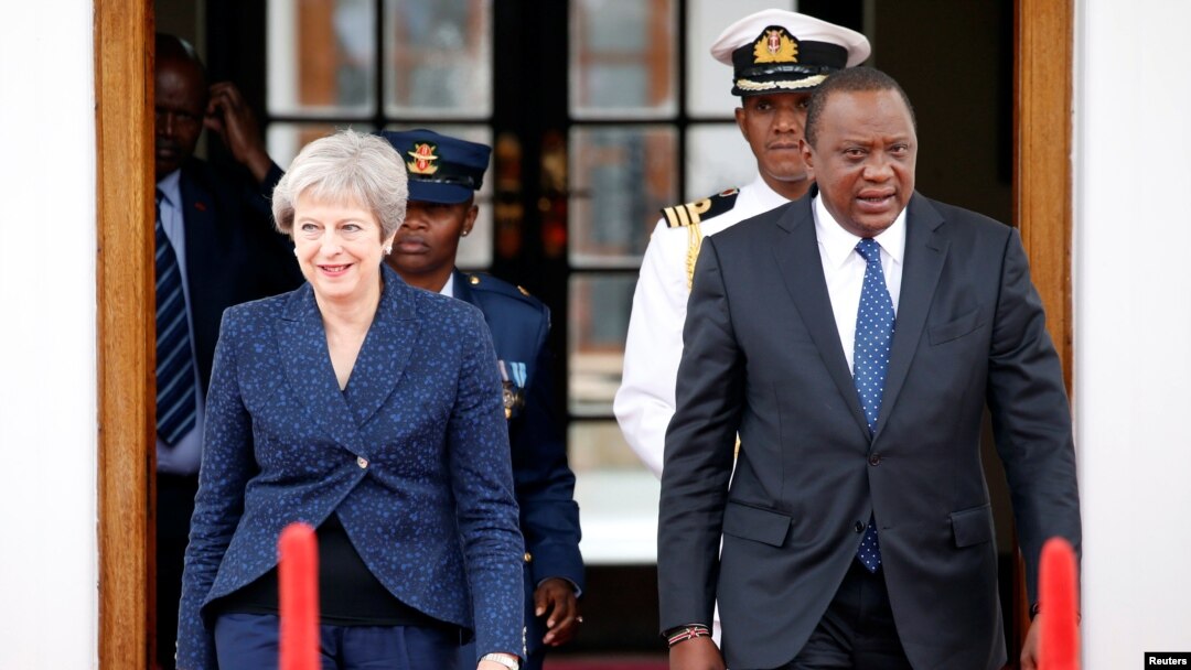 Britain's Prime Minister Theresa May and Kenya's President Uhuru Kenyatta arrive to address a joint news conference at the State House in Nairobi, Kenya, Aug. 30, 2018.