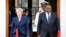 Britain's Prime Minister Theresa May and Kenya's President Uhuru Kenyatta arrive to address a joint news conference at the State House in Nairobi, Kenya, Aug. 30, 2018.