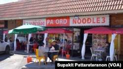 People eat at the tables outside Pa Ord Noodle 3, a Thai restaurant during the coronavirus disease (COVID-19) pandemic in Los Angeles, CA. Sept 2021.