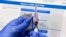 FILE - In this July 27, 2020, photo, a nurse prepares a syringe during a study of a possible COVID-19 vaccine in Binghamton, N.Y.