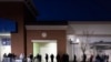 People wait for a Best Buy store to open on Black Friday in Downey, California, November 29, 2024.