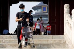 Visitors are seen at the Temple of Heaven in Beijing, China.