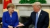 U.S. -- U.S. President Donald Trump greets German Chancellor Angela Merkel in the White House Oval Office in Washington, April 27, 2018