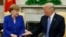 U.S. -- U.S. President Donald Trump greets German Chancellor Angela Merkel in the White House Oval Office in Washington, April 27, 2018
