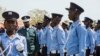 FILE - South South Sudan's President Salva Kiir, second left, inspects police officers during the graduation of the 21st batch of the South Sudan Police in the capital Juba, South Sudan Thursday, April 12, 2018. 