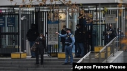 A United Nations security officer directs pedestrian traffic as New York police block access to the UN headquarters on Dec. 2, 2021.