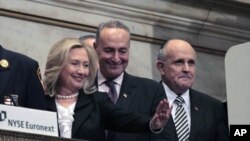 Secretary of State Hillary Clinton, (L) Sen. Charles Schumer (D-NY) and former New York Mayor Rudy Giuliani (R) participate in the opening bell ceremonies of the New York Stock Exchange, September 9, 2011. The New York Stock Exchange held ceremonies to ma