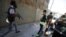 Free Syrian Army fighters carry the body of a fellow fighter after he was shot by a sniper at Seif a Dawla district in Syria's northwestern city of Aleppo September 4, 2012. 