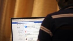 A man opens the Facebook page on his computer to fact check coronavirus disease (COVID-19) information, in Abuja, Nigeria March 19, 2020. Picture taken March 19, 2020. REUTERS/Afolabi Sotunde