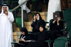 Saudi female journalists attend a men's handball match in Jeddah, Jan. 31, 2012. Female journalists were not always allowed to cover sporting events, because of strict segregation of the sexes outside the home.