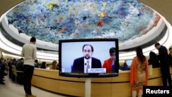 Zeid Ra'ad al-Hussein, U.N. High Commissioner for Human Rights is pictured on a screen during his speech at the 36th Session of the Human Rights Council at the United Nations in Geneva, Switzerland, Sept. 11, 2017. Picture taken with a fisheye lens.