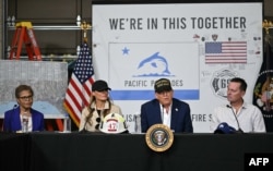 Los Angeles Mayor Karen Bass, left, and first lady Melania Trump look on as U.S. President Donald Trump speaks during a fire emergency briefing at Station 69 in Pacific Palisades, a neighborhood of Los Angeles, on Jan. 24, 2025.