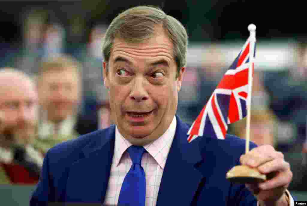 Brexit campaigner and Member of the European Parliament Nigel Farage holds a Union Jack flag during a debate on Brexit after the vote on British Prime Minister Theresa May&#39;s Brexit deal, at the European Parliament in Strasbourg, France.