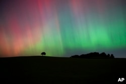 FILE - The Northern Lights, also known as the Aurora Borealis, are seen in the sky near Knaresborough, England, Oct. 11, 2024. (Andrew Hawkes via AP)