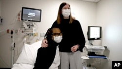 Pig kidney recipient Towana Looney sits with transplant surgeon Dr. Jayme Locke at NYU Langone Health, in New York City, on Dec. 10, 2024.