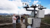 Climate Data Analyst Casey Olson, left, of Utah State University, conducts a tour during a visit to the Utah Climate Center's climate reference station on April 1, 2024, in Logan, Utah. (AP Photo/Rick Bowmer)