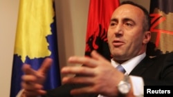 FILE - Ramush Haradinaj, a Kosovo Albanian former guerilla commander who served briefly as prime minister, speaks during an interview with Reuters at the AAK headquarters in Pristina, Dec. 4, 2012.