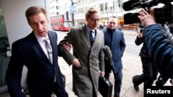 FILE - Alexander Nix, CEO of Cambridge Analytica arrives at the offices of Cambridge Analytica in central London, Britain, March 20, 2018. 