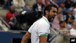 Marin Cilic dari Kroasia setelah mengalahkan petenis Jepang Kei Nishikori dalam final AS Terbuka (8/9). (AP/Mike Groll)