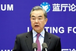 FILE - Chinese State Councilor and Foreign Minister Wang Yi delivers a speech in Beijing, China, Feb. 22, 2021.