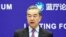 FILE - Chinese Foreign Minister Wang Yi delivers a speech in Beijing, China, Feb. 22, 2021. 