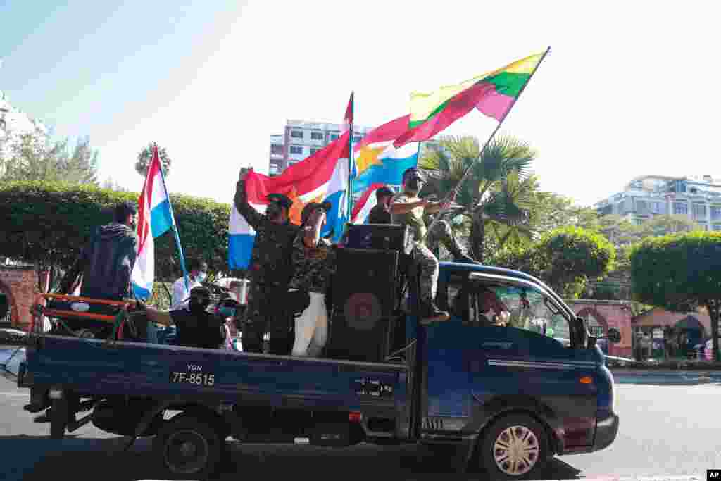 Supporters of the military wave national and military flags in Yangon, Myanmar. The military staged a coup and detained senior politicians including Nobel laureate and de facto leader Aung San Suu Kyi.