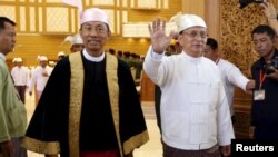 Myanmar's President Thein Sein, right, and speaker of Union Parliament Shwe Mann arrives at the Union Parliament in Naypyitaw, Jan. 28, 2016. 