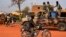 A file photo taken on Jan. 26, 2013 shows Chadian soldiers on a truck leaving Niamey for the Malian border.