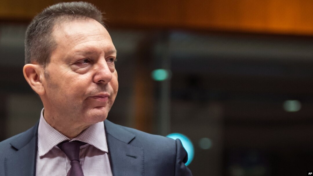 FILE - Greece's Finance Minister Yannis Stournaras arrives for a meeting of EU finance ministers at the European Council building in Brussels, May 6, 2014. 