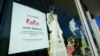 FILE - A "Now Hiring" sign is seen in a store window in the Wynwood Arts District of Miami, Florida, Jan. 27, 2021. 