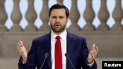 FILE - U.S. Vice President JD Vance delivers a speech during the plenary session of the Artificial Intelligence (AI) Action Summit at the Grand Palais in Paris, Feb. 11, 2025. 