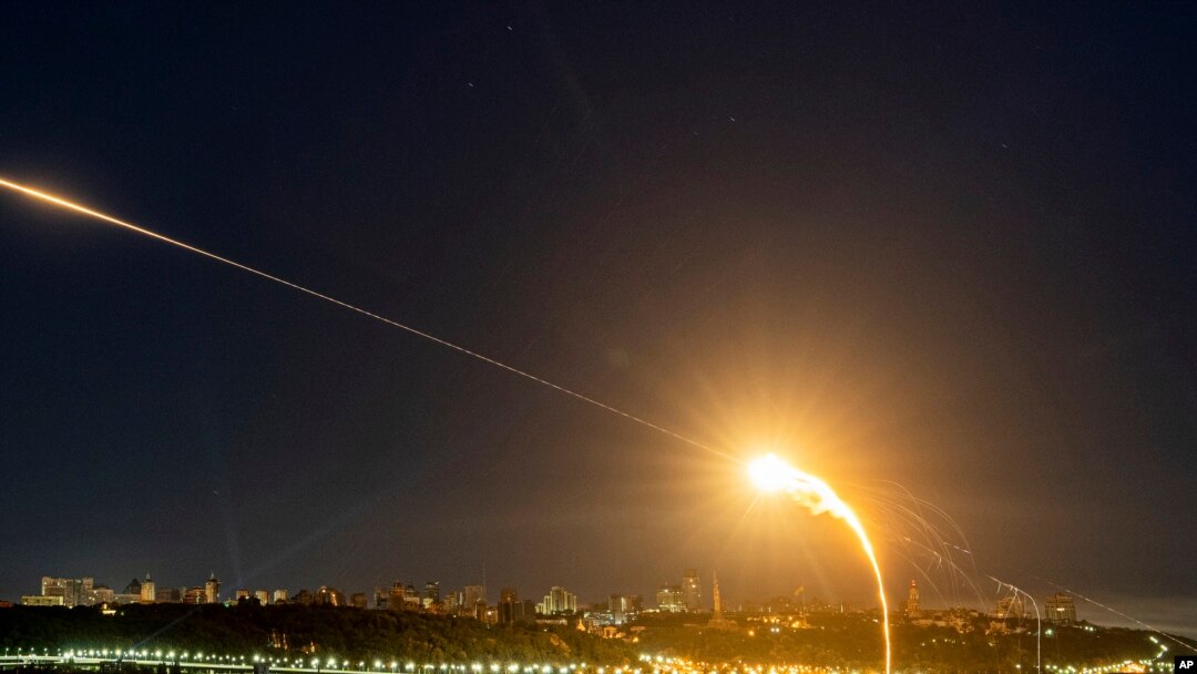 FILE - Ukrainian air defense intercepts a Shahed drone mid-air in the third Russia aerial attack on the capital in the last 24 hours in Kyiv, Ukraine, on May 30, 2023. On Feb. 14, 2024, Ukraine reported shooting down 14 of the drones and one missile.