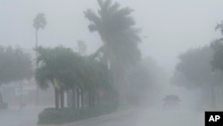 A Lee County Sheriff's officer patrols the streets of Cape Coral, Florida, as heavy rain falls ahead of Hurricane Milton, Oct. 9, 2024.