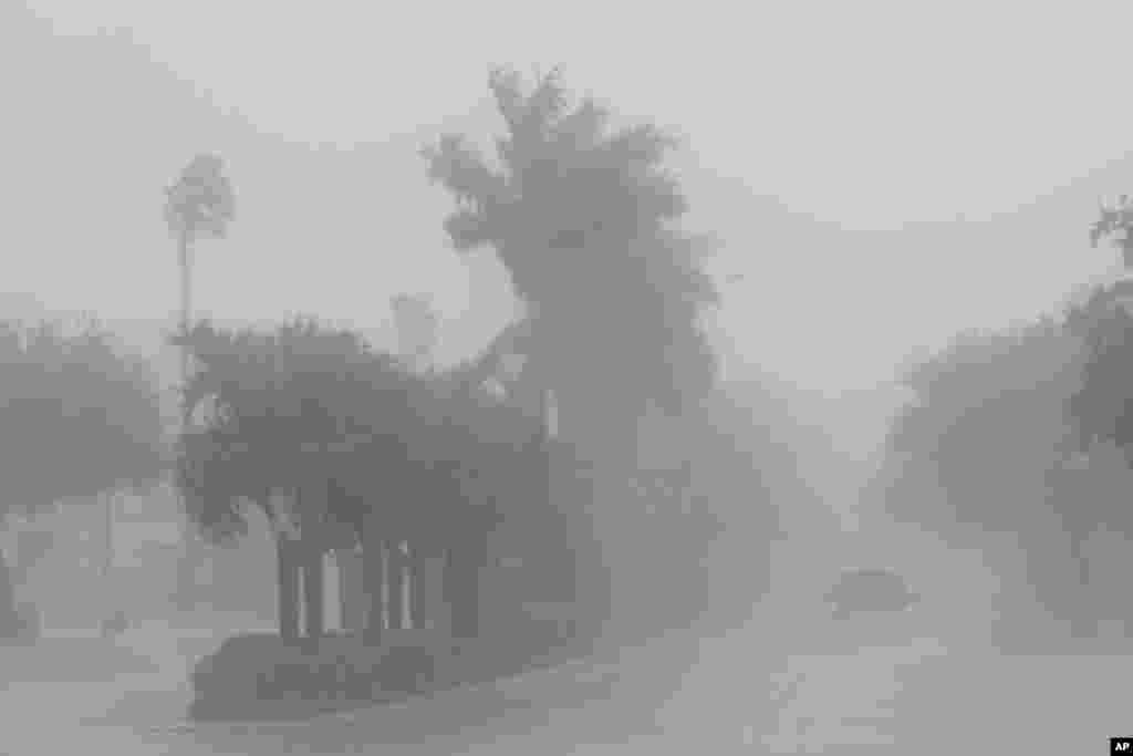 A Lee County Sheriff's officer patrols the streets of Cape Coral, Florida, as heavy rain falls ahead of Hurricane Milton, Oct. 9, 2024.