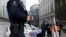 Belgian police officers secure an access to the federal police headquarters in Brussels, March 19, 2016, after Salah Abdeslam, the most-wanted fugitive from November's Paris attacks, was arrested after a shootout with police in Brussels on Friday. 