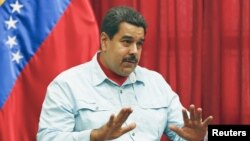 Venezuela's President Nicolas Maduro speaks during a meeting at Miraflores Palace in Caracas, March 26, 2015.