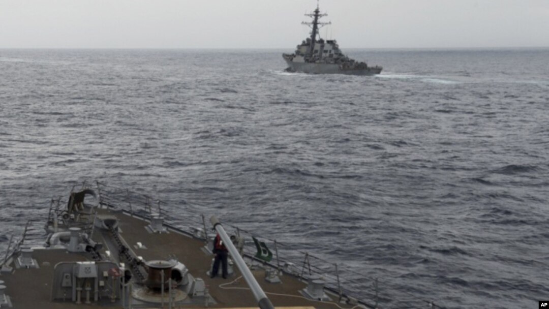 FILE - A U.S. Navy ship is seen from the bridge of the guided-missile destroyer USS Spruance, in the South China Sea, Oct. 17, 2016, in a photo provided by the U.S. Navy.