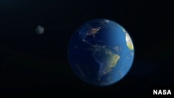 A screenshot from a NASA video illustrates how far asteroid 1998 OR2 will be from earth when it flies by. Scientists say the 2km-wide asteroid will safely pass at a distance of 6.3 million kilometers from Earth. (Courtesy NASA)