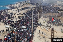 Palestinians, who were displaced to the south at Israel's order during the war, make their way back to their homes in northern Gaza, amid a ceasefire between Israel and Hamas, in the central Gaza Strip, Jan. 27, 2025.